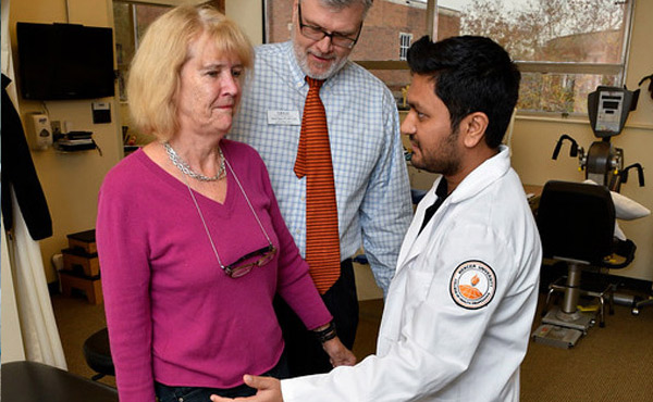 Mercer physical therapy student examines a patient while supervised